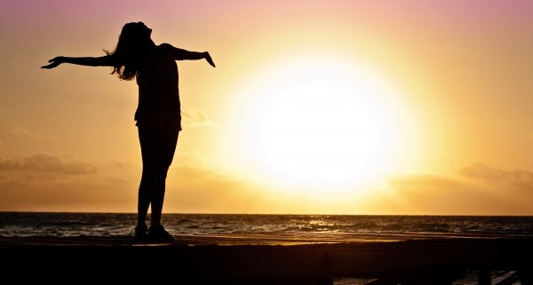 A Happy Woman At Sunset