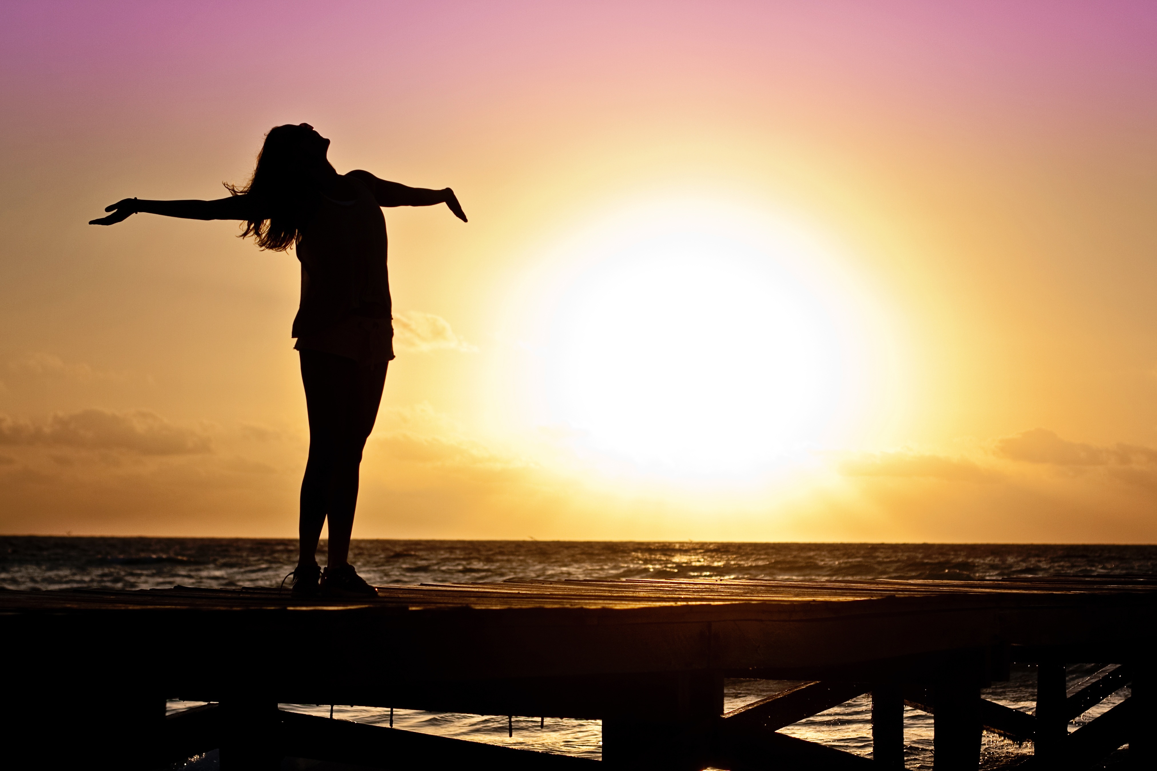 A Happy Woman At Sunset